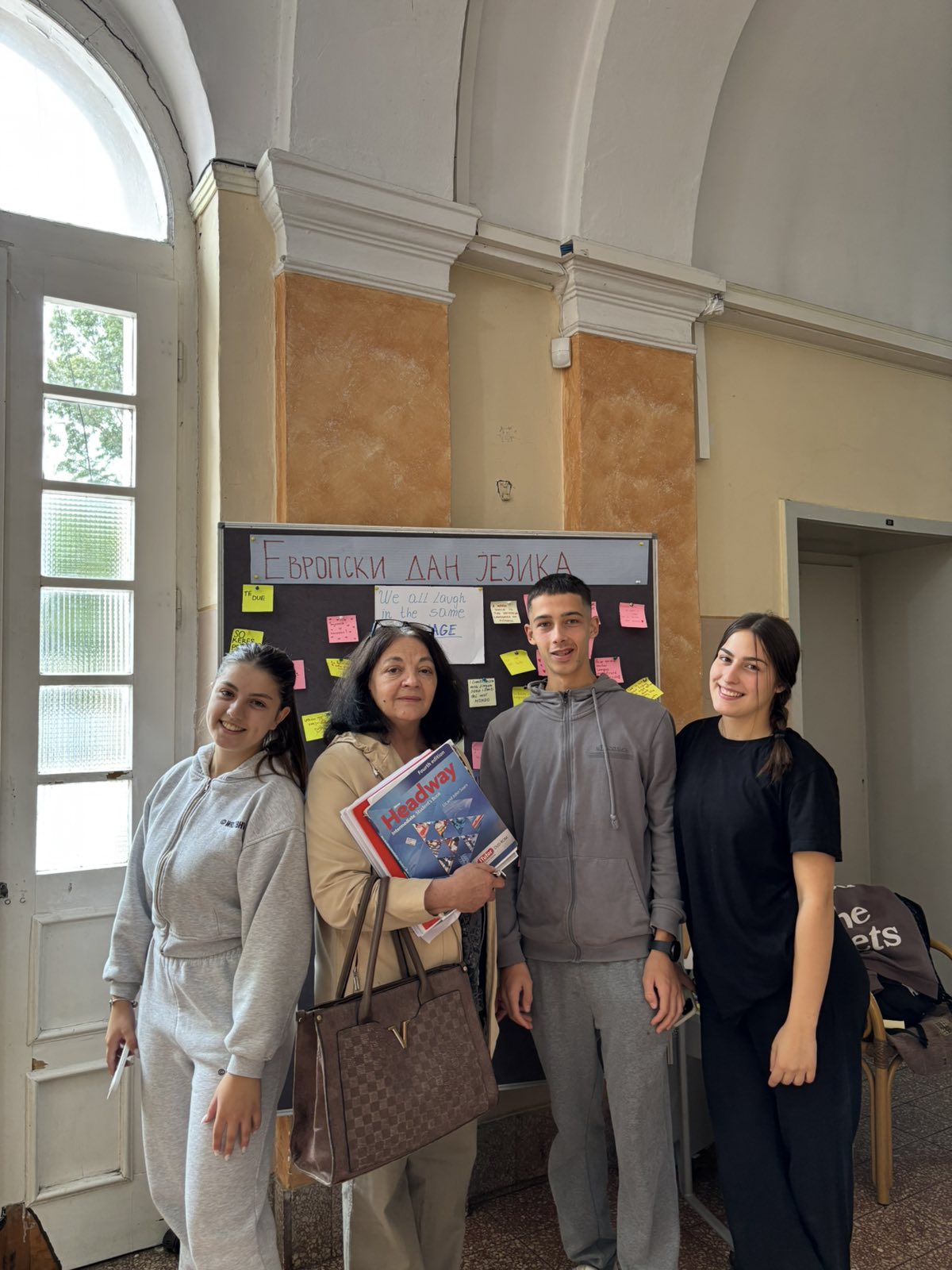 A group of people standing in front of a blackboard
AI-generated content may be incorrect.