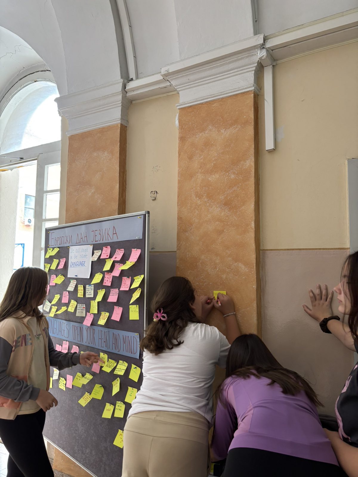 A group of people writing on a board
AI-generated content may be incorrect.