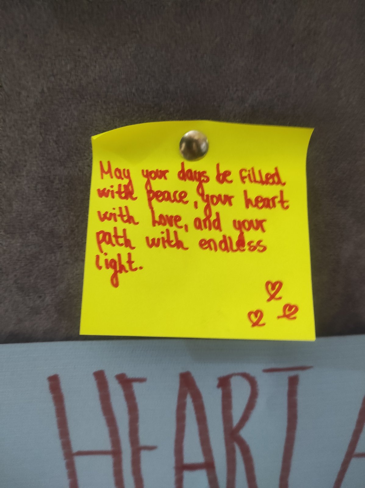 A yellow post-it note pinned to a wall
AI-generated content may be incorrect.