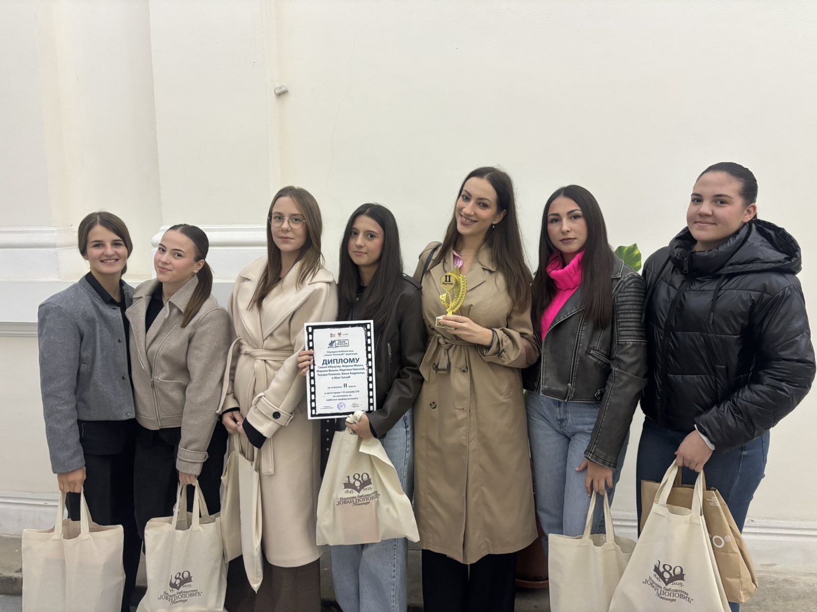 A group of women posing for a photo

AI-generated content may be incorrect.