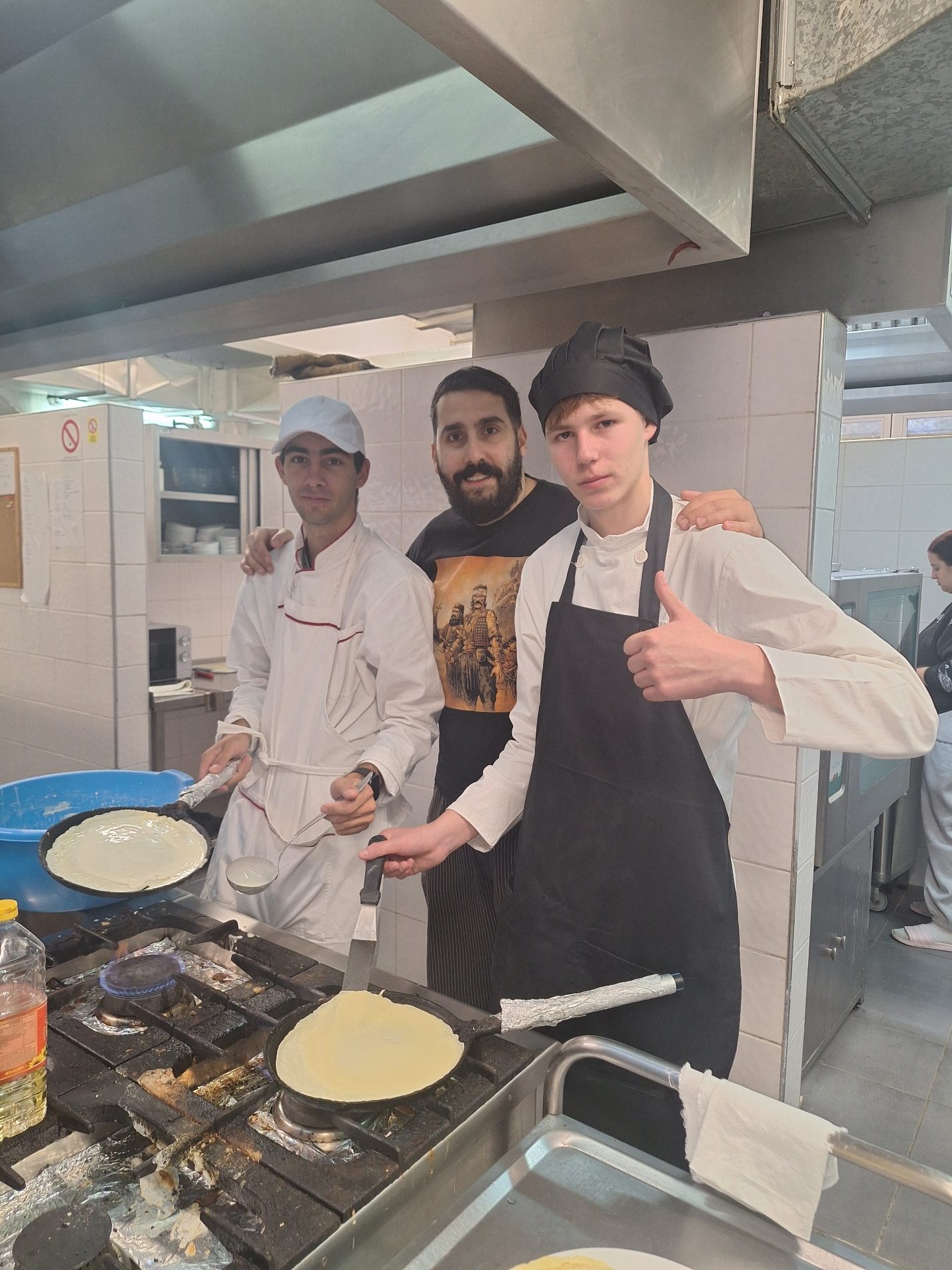 A group of men in a kitchen
AI-generated content may be incorrect.