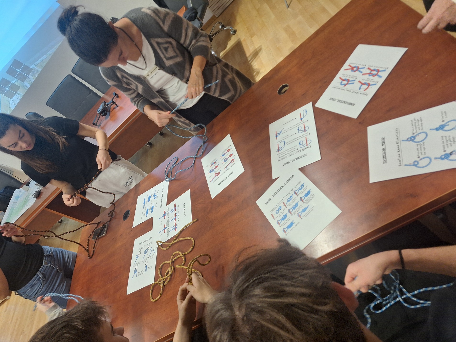 A group of people around a table
AI-generated content may be incorrect.