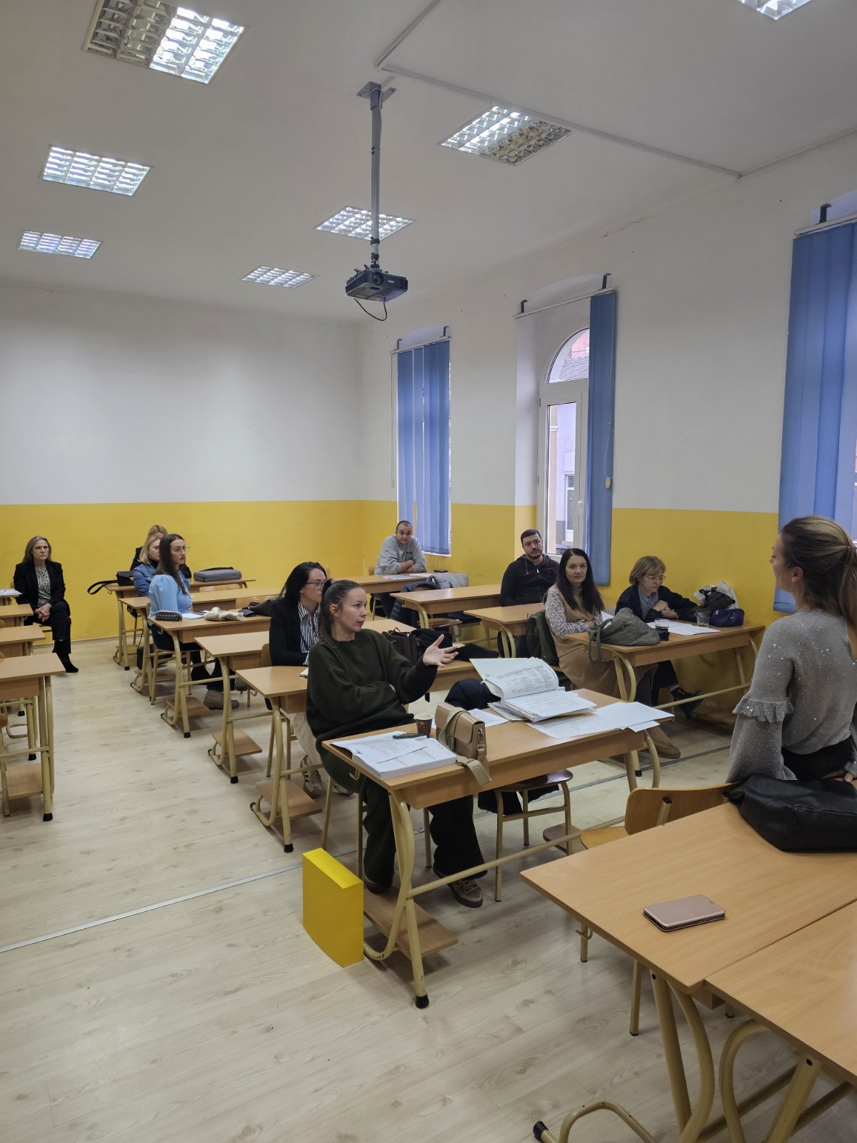 A group of people sitting in a classroom
AI-generated content may be incorrect.