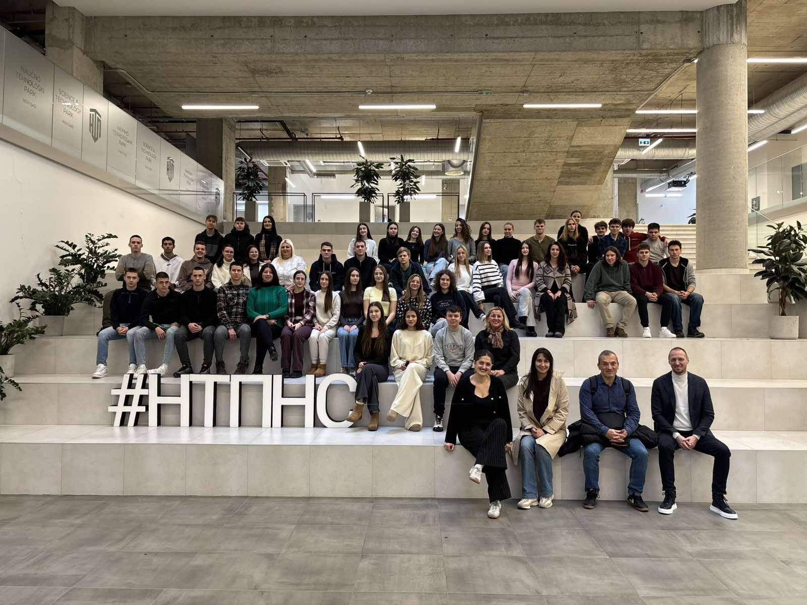 A group of people sitting on a staircase
AI-generated content may be incorrect.