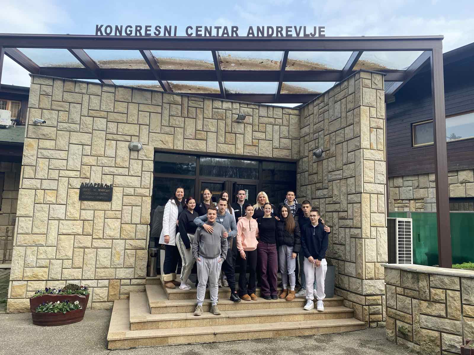 A group of people standing on steps in front of a building
AI-generated content may be incorrect.