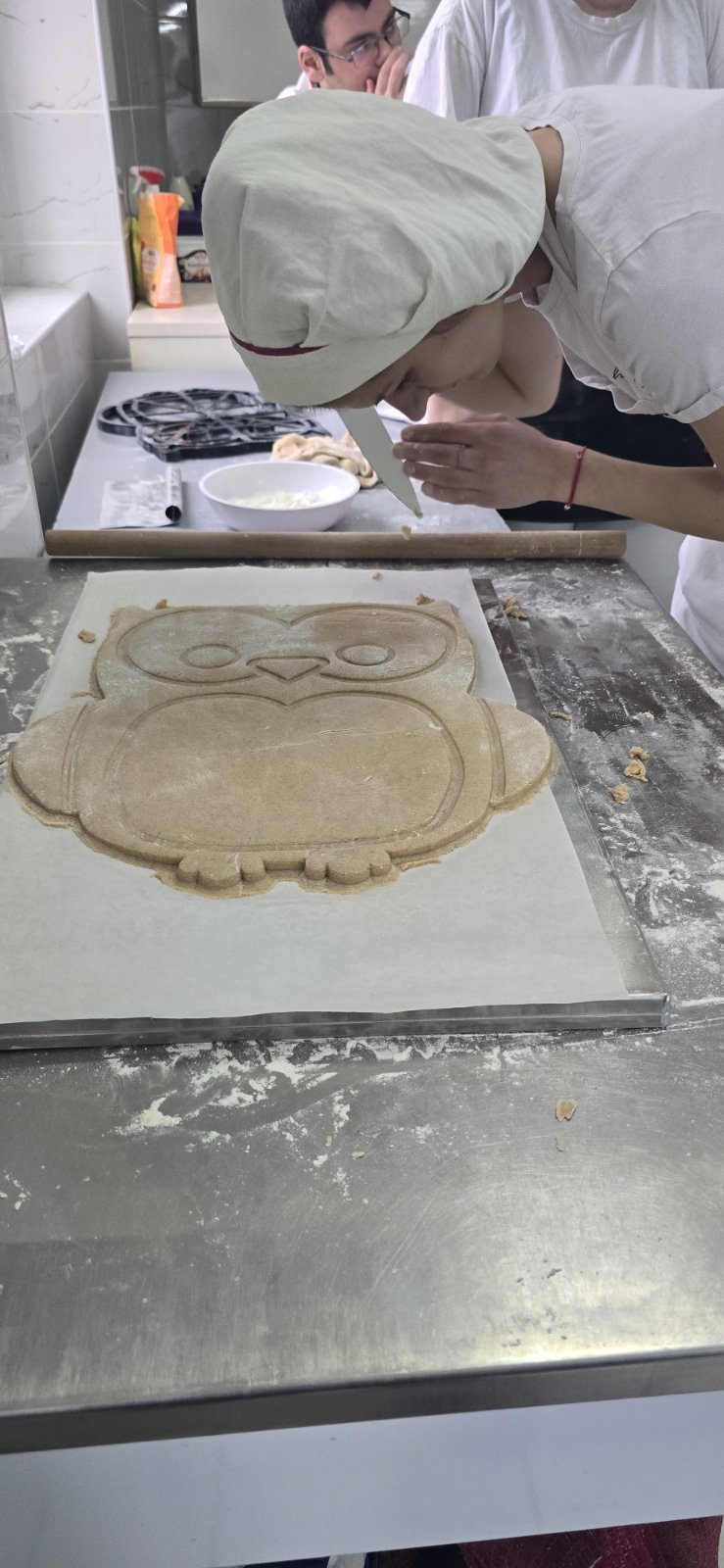 A person making cookies on a table

AI-generated content may be incorrect.